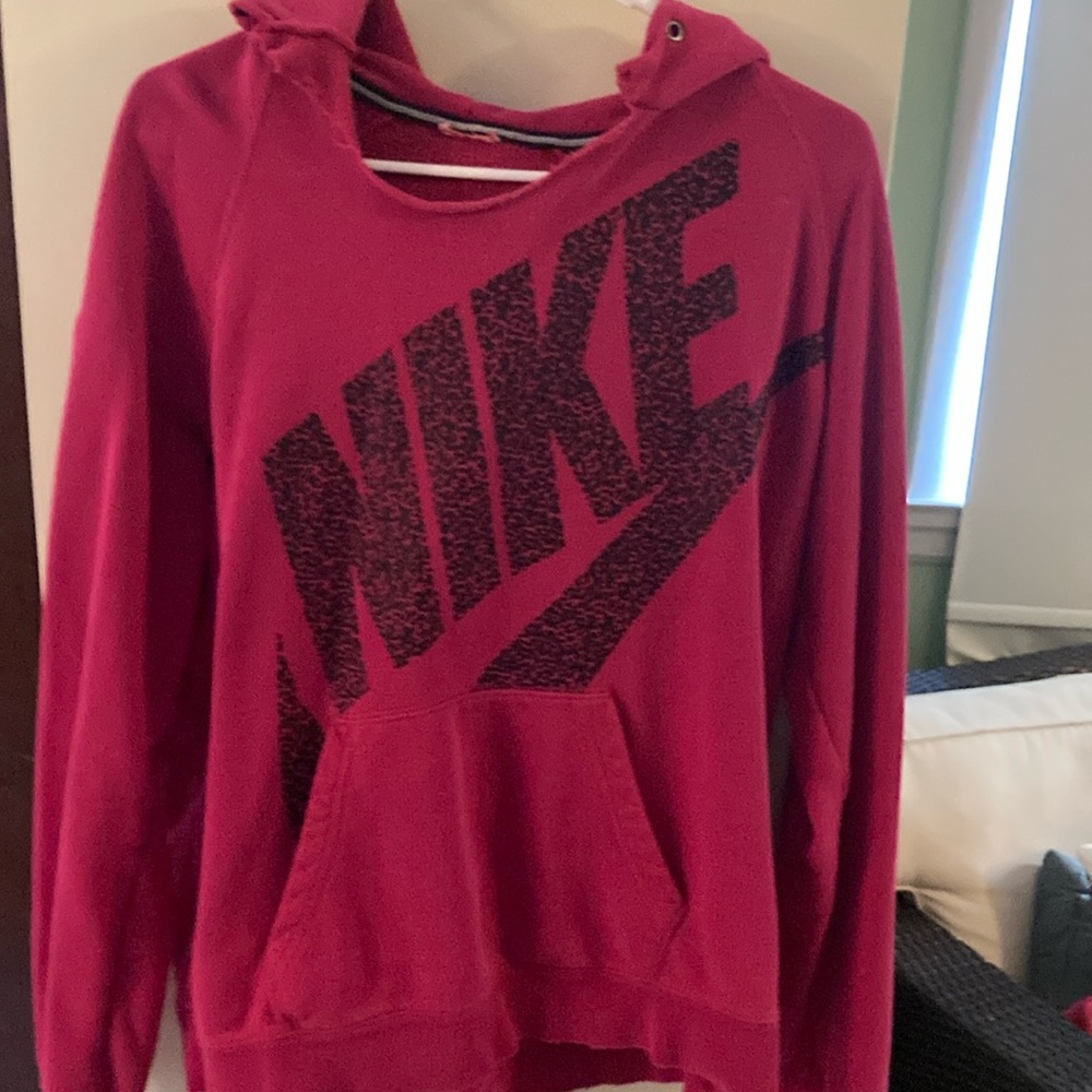 Dark Pink Nike hooded sweatshirt with Black Nike Logo.